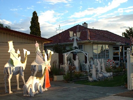 Night Approaches for Christmas Themes & Lights on Homes - above, corner Milton & Vogel Streets, Palmerston North, Manawatu, New Zealand - 9 December 2000