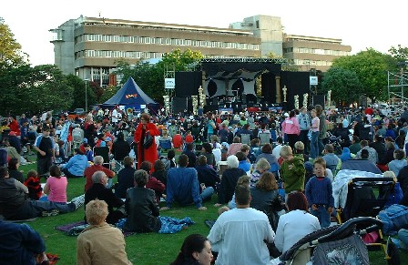 The sun's going down, the people are entertained for New Year in The Square, Palmerston North, Manawatu, New Zealand - 31 December 2003